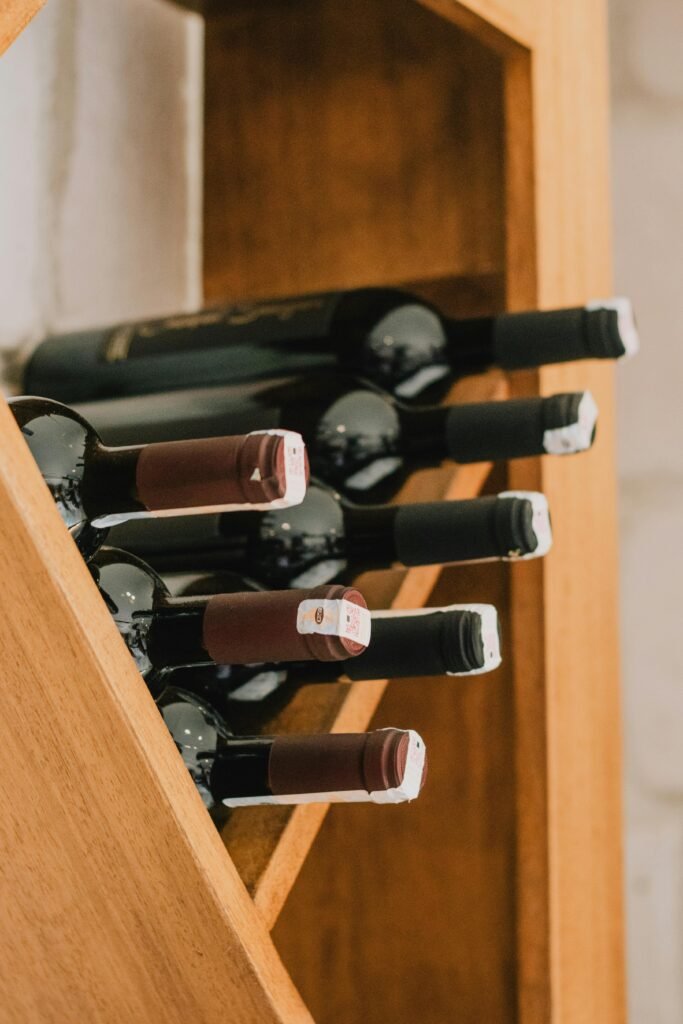 A collection of wine bottles neatly arranged in a wooden rack, showcasing elegance and style.